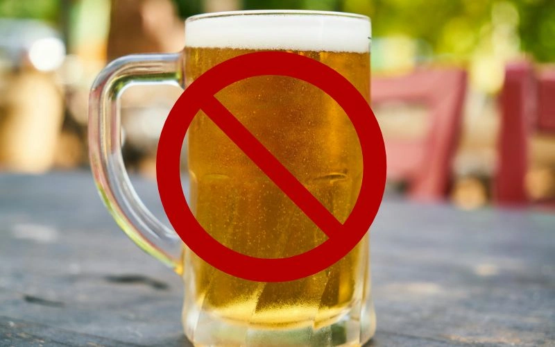 Glass of beer with a red no-alcohol prohibition symbol on it